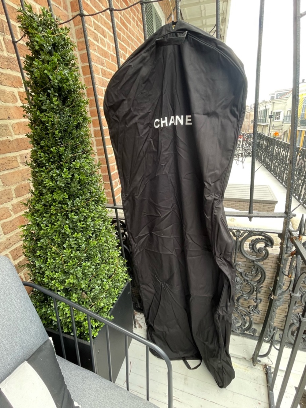 CHANEL Black Zippered Accessory with Embossed Logo and Chanel velvet hanger